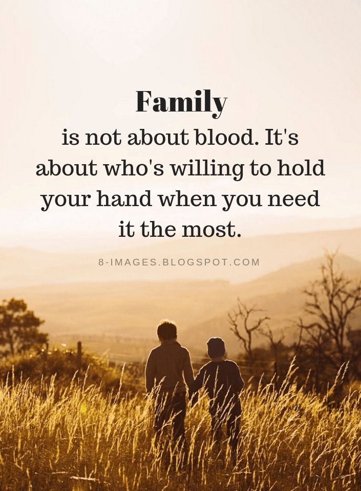 two people standing in tall grass with the words family is not about blood it's about