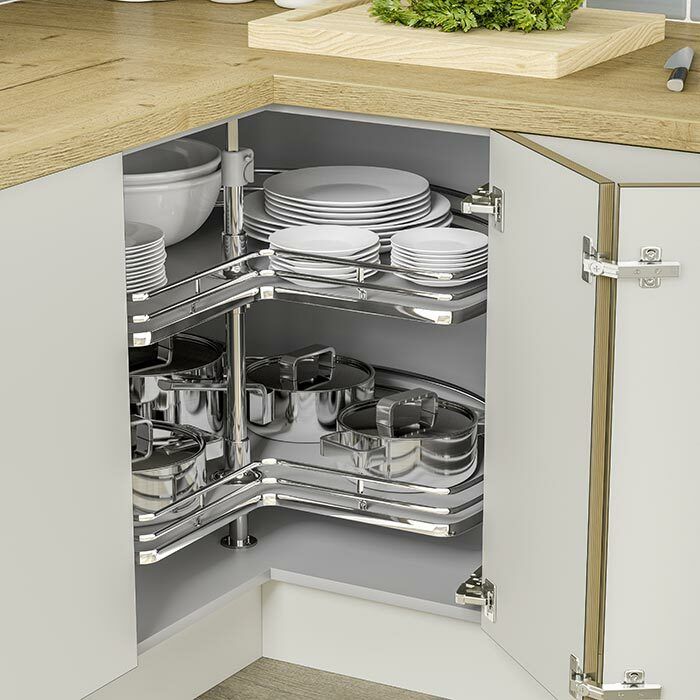 an open cabinet in a kitchen filled with dishes