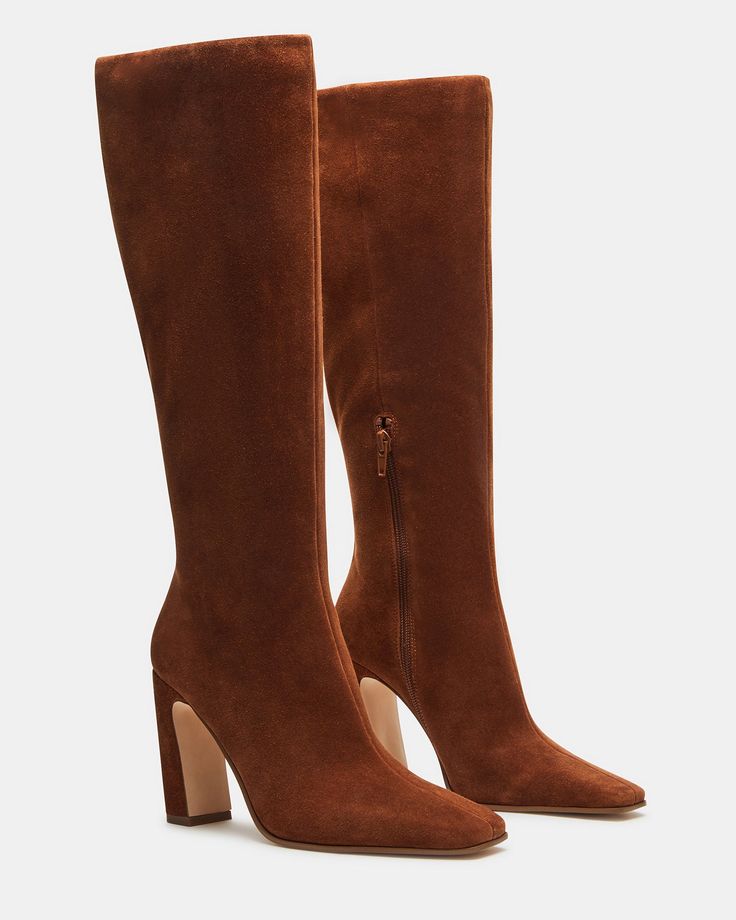 Expertly constructed, the LIZETTE boot is designed with a sleek knee-high silhouette, square toe, and stylish heel. This boot is durable and fashionable, making it the perfect addition to any wardrobe. Elevate your look with these timeless boots. 3.5 inch heel height Size 6 measurements: 14.5 inch shaft circumference, 14 inch shaft height Size 8 measurements: 16 inch shaft circumference, 14.5 inch shaft height Size 10 measurements: 16.75 inch shaft circumference, 15 inch shaft height Textile and I Heart Shoes, Timeless Boots, Boots Steve Madden, Cognac Boots, Tall Brown Boots, Fall Booties, Stylish Heels, Candy Sweet, Heart Shoes