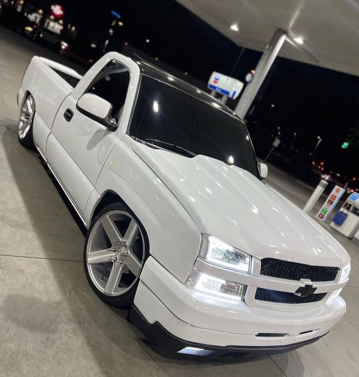 a white truck parked in a parking garage