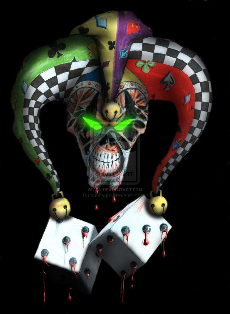 an evil clown holding two playing cards in his hands