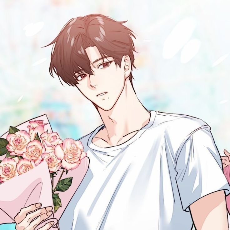 a man is holding flowers in his hands