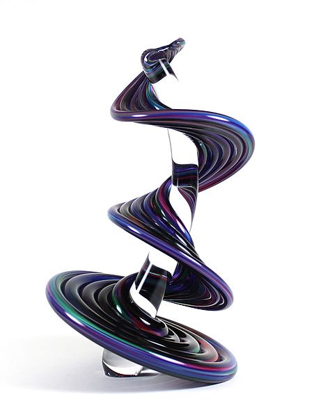 an artistic sculpture made out of black and purple swirls on top of each other