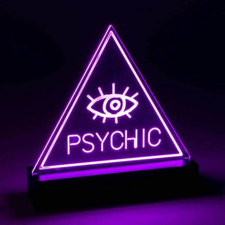 a neon sign that says psychic with an eye in the triangle on top of it