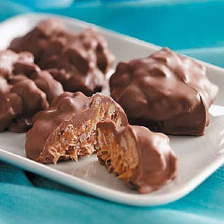 chocolate covered cookies on a white plate