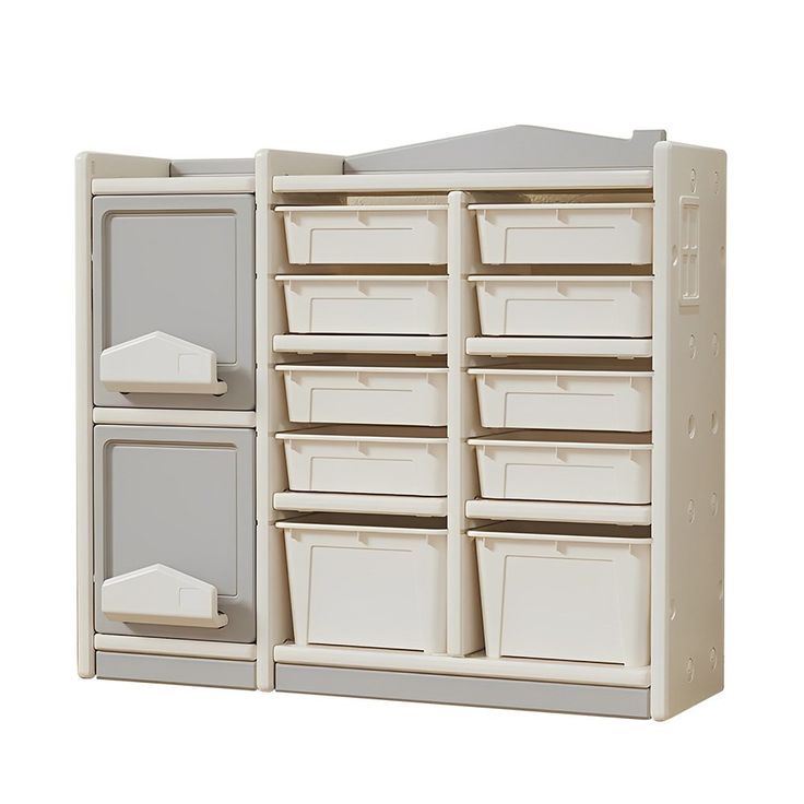 a large white cabinet with many bins on it