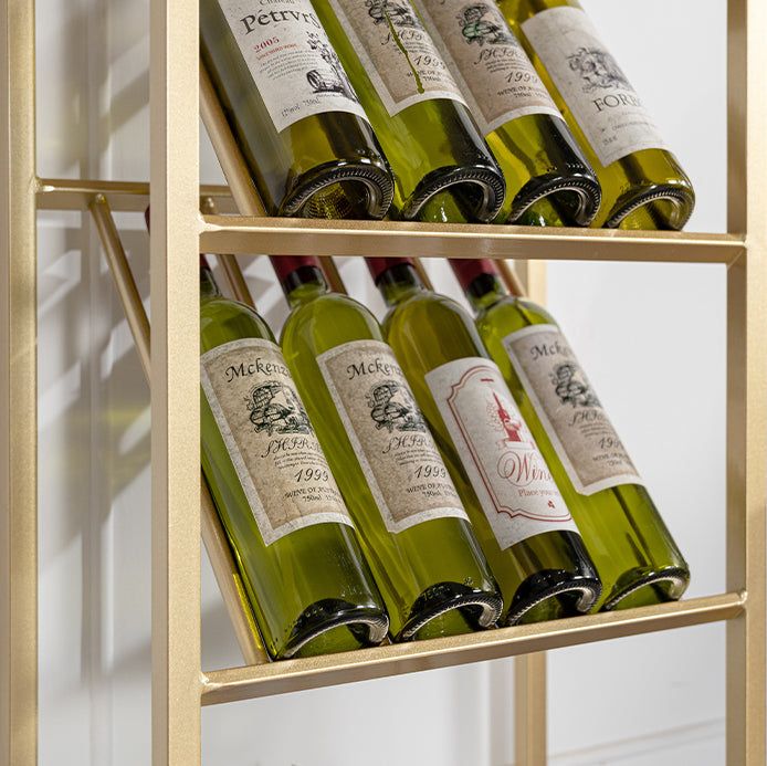 several bottles of wine sit on shelves in a room