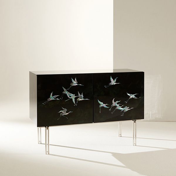 two black cabinets with birds painted on them