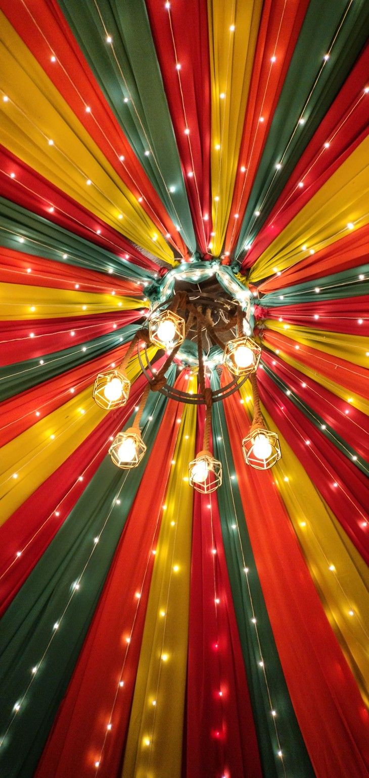 the ceiling is decorated with multicolored lights