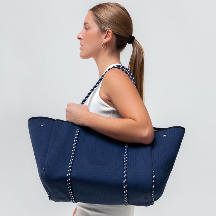 The cool, everyday bag that’s perfect for work, gym, beach, traveling, and everything in between. Functional Blue Shoulder Bag For Travel, Sporty Tote Travel Bag For Daily Use, Blue Casual Bag For Everyday Use, Casual Weekender Bag With Reinforced Handles For Travel, Casual Navy Shoulder Bag With Double Handle, Blue Casual Everyday Bag, Casual Double Handle Gym Bag For Travel, Blue Tote Travel Bag, Blue Tote Weekender Bag For Everyday Use