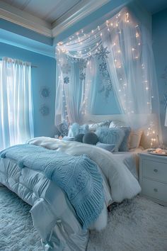 a bedroom decorated in blue and white with fairy lights on the headboard, curtains, and bed linens