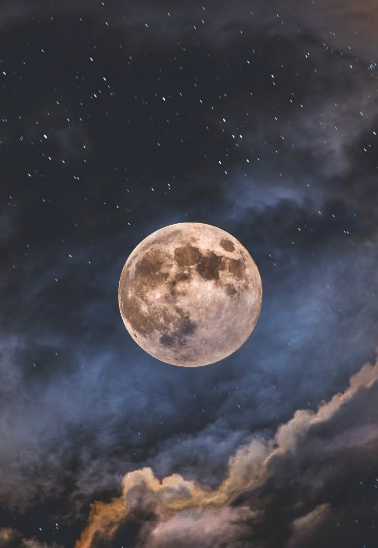 the full moon is shining brightly in the night sky with clouds and stars around it