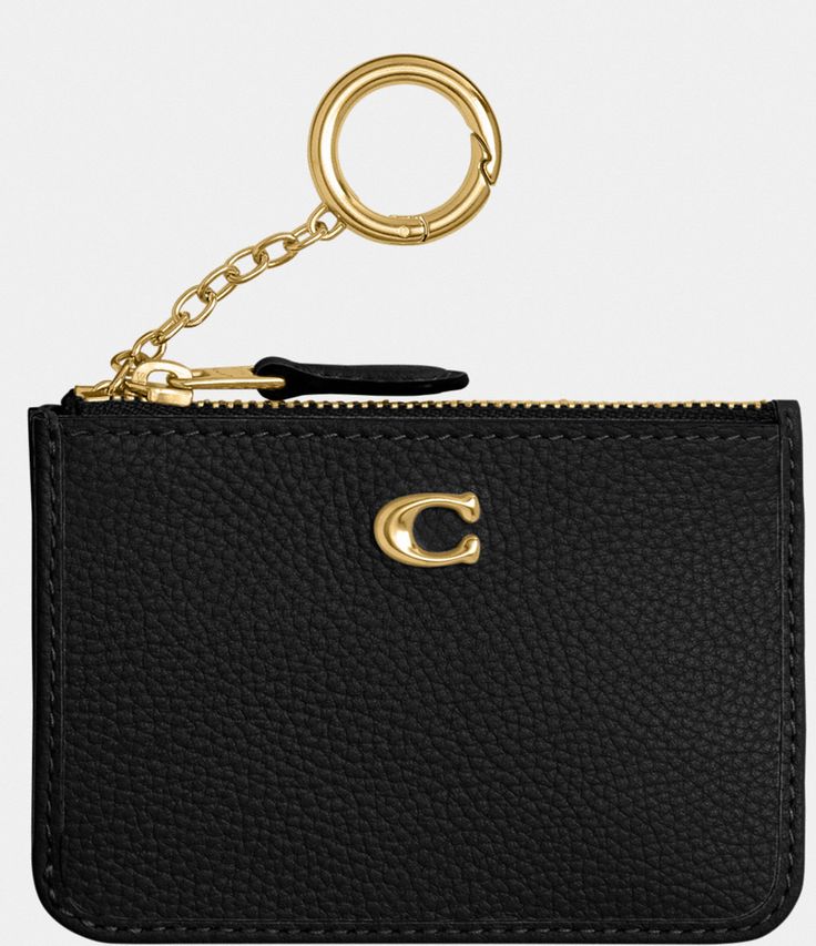 From COACH&#x2C; the Pebbled Leather Mini Skinny ID Case features:Polished pebble leatherCredit card slot and ID windowZip-top closure&#x2C; fabric liningAttached split key ringApprox. 4.25'' L x 3'' HImported. Elegant Gold Coach Coin Purse, Classic Gold Leather Coin Purse, Luxury Coach Coin Purse With Card Slots, Elegant Coach Leather Card Holder, Classic Coach Leather Coin Purse, Coach Gold Leather Wallet, Coach Black Leather Card Holder, Black Leather Coach Card Holder, Coach Leather Coin Purse With Coin Pocket