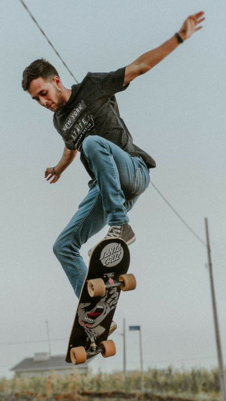 a man flying through the air while riding a skateboard