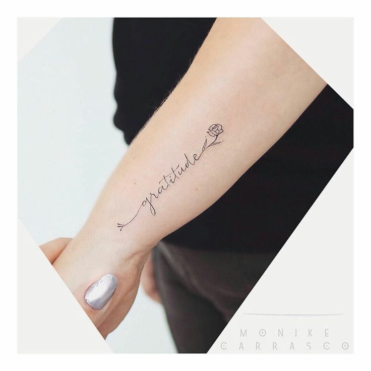 a woman's arm with the word mother written in cursive writing on it