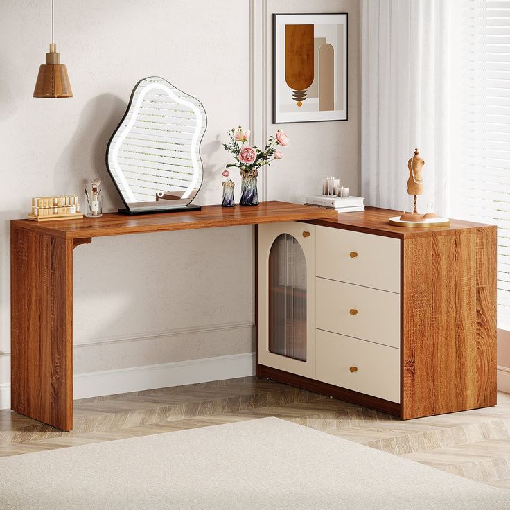 a wooden desk with a mirror and vase on it in front of a white wall