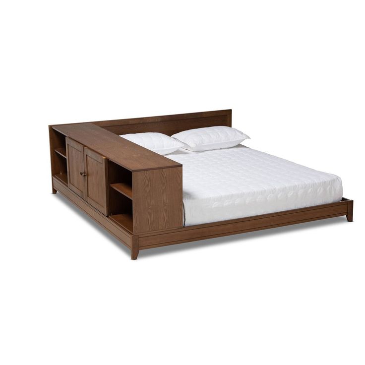 a bed with a wooden headboard and night stand on top of it, against a white background