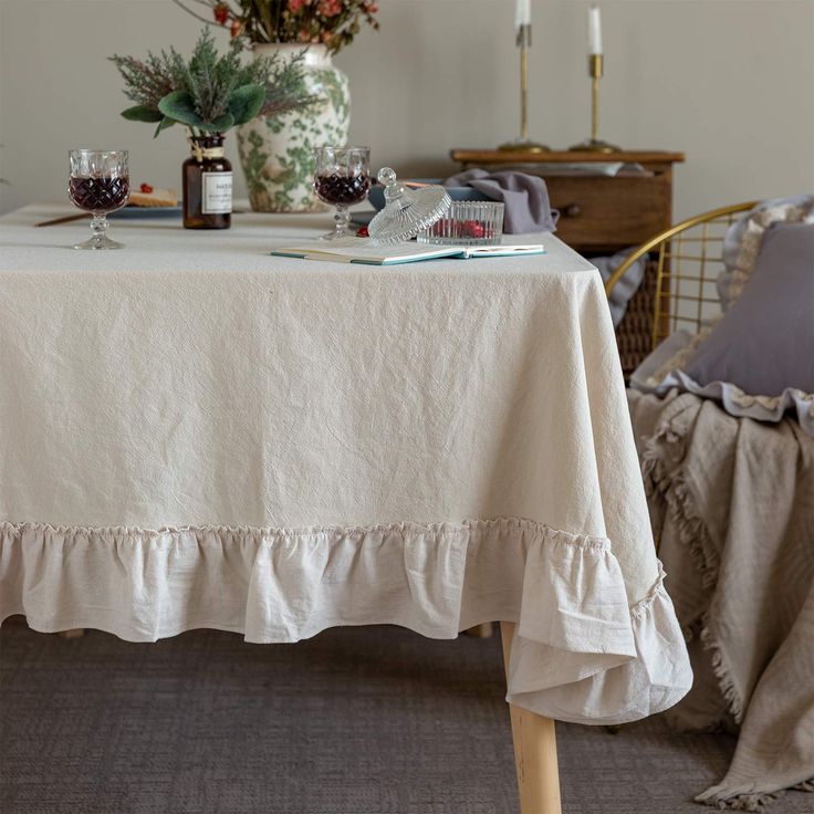 the table is covered with white linens