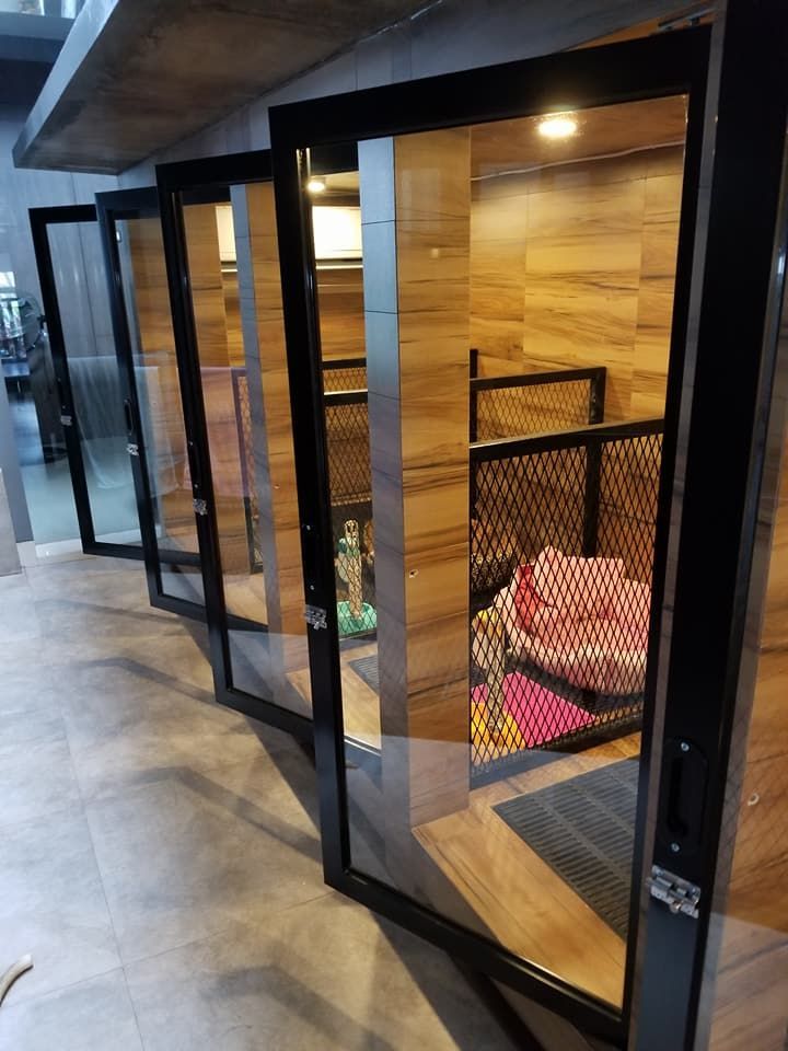 the inside of a building with wooden walls and glass doors