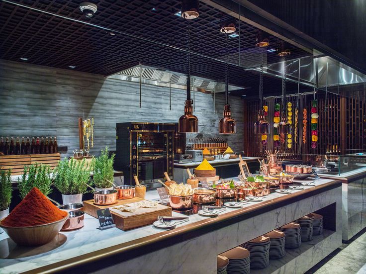 a kitchen filled with lots of food and cooking utensils on top of a counter