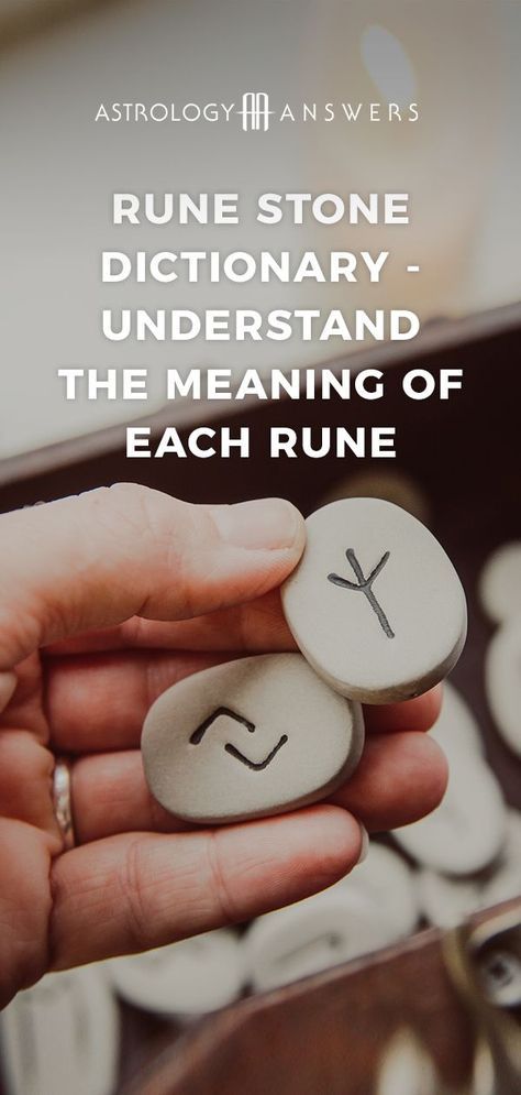 a person holding two rocks with the words, rune stone dictionary understand the meaning of each