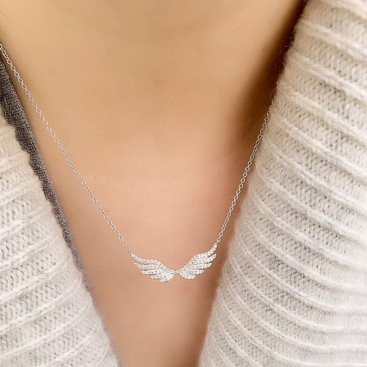 Soft and feminine, this Angel Wing Necklace is set in 14k gold on a 16-18" adjustable chain, and features 72 hand set diamonds. Elegant curves and neat rows of diamonds create a beautiful feathered wings effect. Angel Wings Jewelry Gold, Angel Wing Necklace Silver, Ramadan Photos, Feathered Wings, Angel Wings Necklace, Diamond Angel, Angel Wings Jewelry, Soft And Feminine, Womens Silver Jewelry