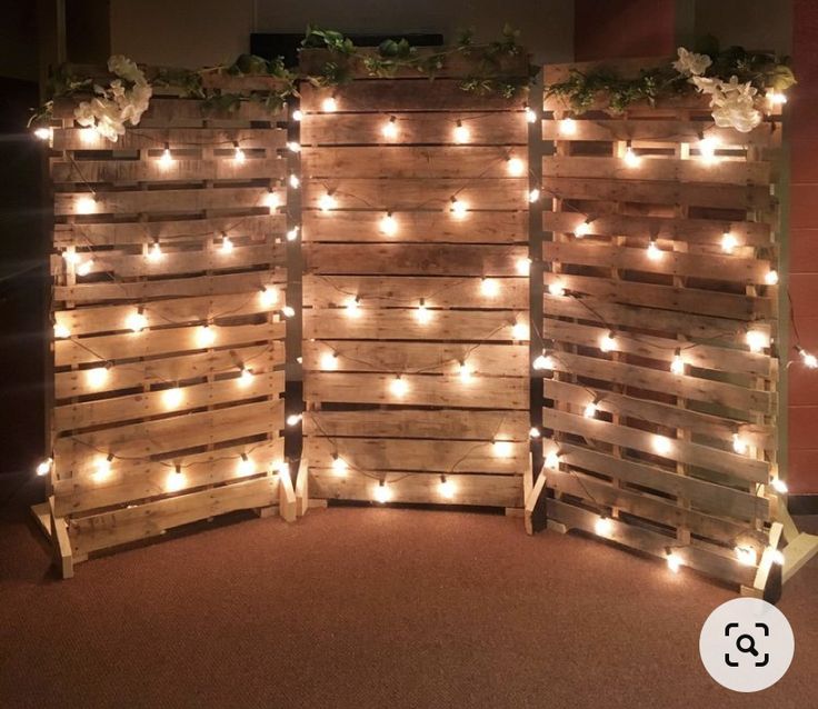 three wooden pallets with lights on them