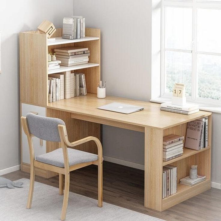 a wooden desk sitting next to a window in a room with bookshelves and a chair