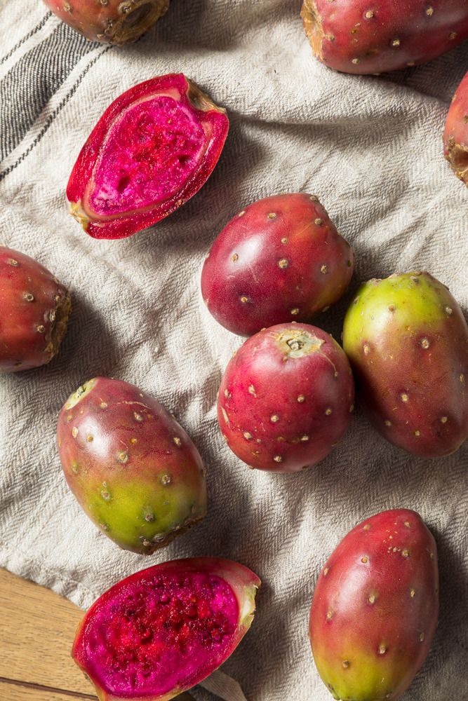 there are many fruits that have been cut in half and placed on the table top