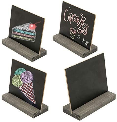 four chalkboards with different designs on them and one has an ice cream cone in the middle