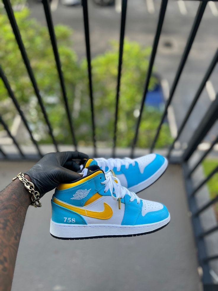 Custom St.Lucia Themed Air Jordan 1s. This price includes purchasing the sneakers. All Adult sizes are for both Men and Women. All prices are USD. Color Shade of shoe may vary on screen versus in person and under different lighting. All shoes are Made to Order and turnaround for completion is 4-6 weeks per shoe. Girlfriend Duties, Custom Made Jordans, Jordan Shoes For Men, Air Jordan 1s, Jordan 1s, Basketball Teams, St Lucia, Air Jordan 1, Color Shades