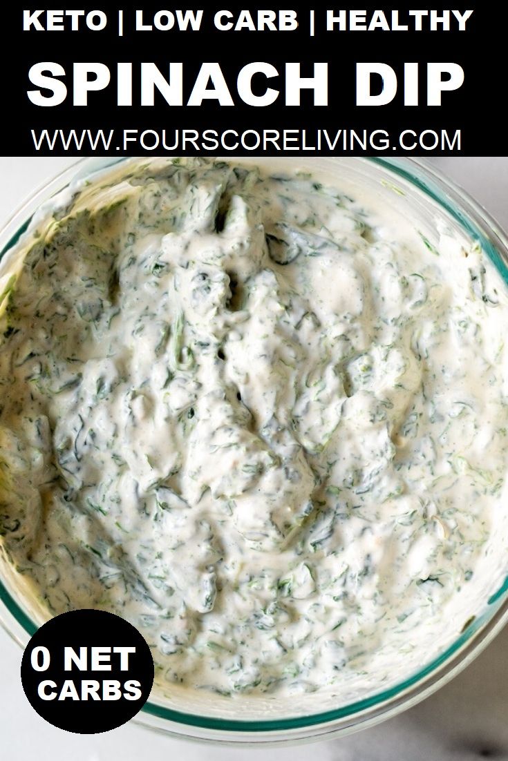 a bowl filled with spinach dip on top of a white table next to the words keto low carb healthy spinach dip