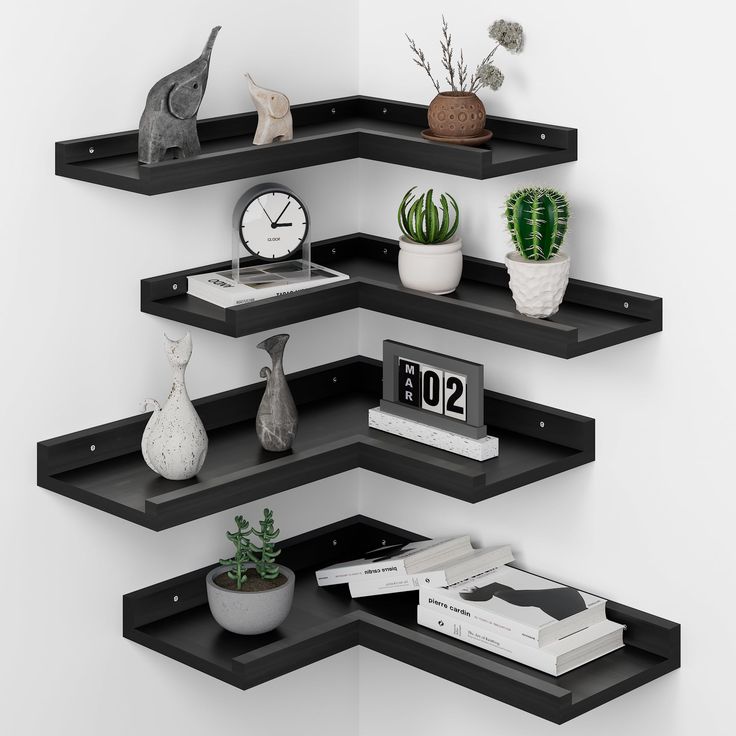 three black shelves with different types of plants and books on them, one has a clock