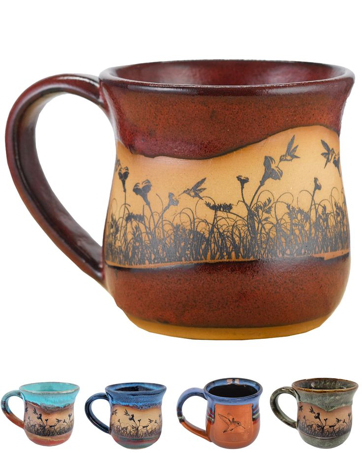 four mugs with different designs on them and one has birds flying over the grass