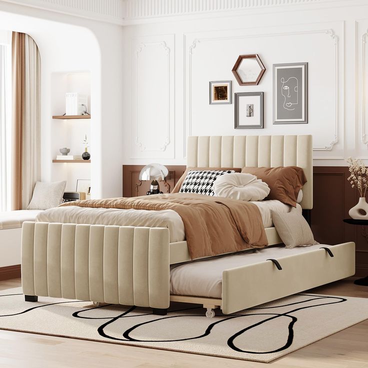 a bedroom with a bed, rugs and pictures on the wall above it is shown