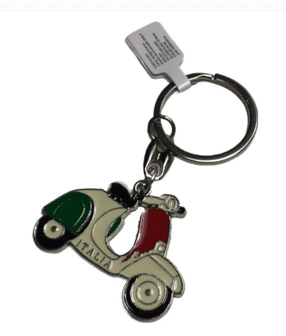 a keychain with an italian flag and a scooter on the front