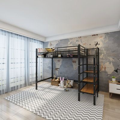 a bedroom with a bunk bed, desk and rug in front of a large window