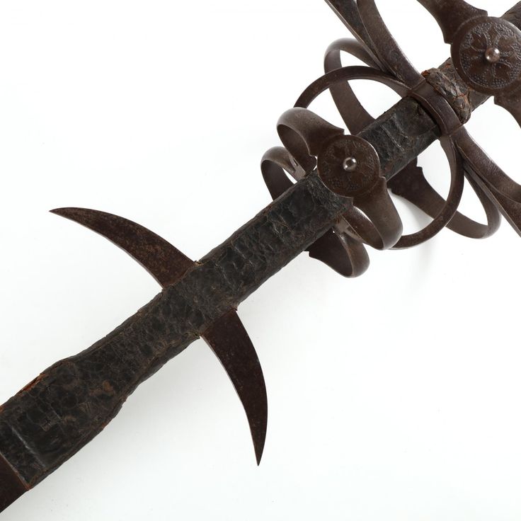 an old rusted metal garden tool on a white background