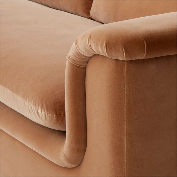 a close up view of the back end of a couch with an arm rest on it