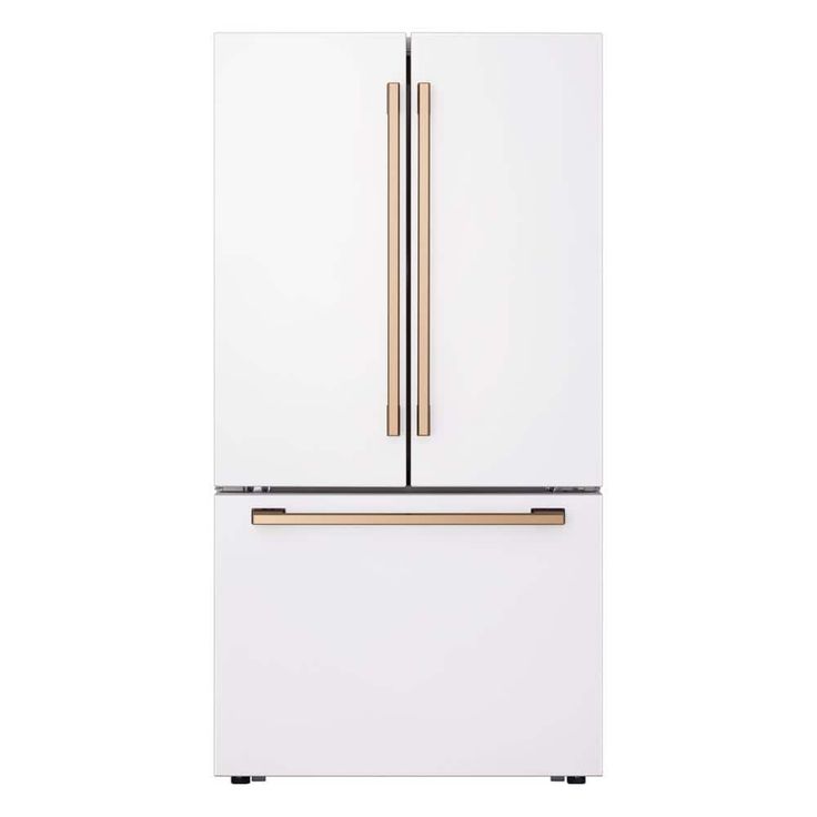 a white refrigerator freezer with two gold handles