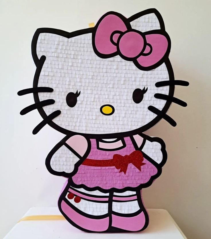 a hello kitty cut out on top of a table