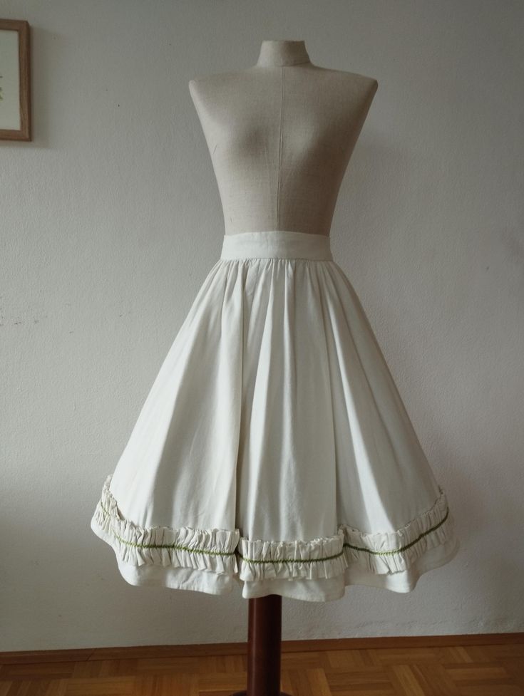 A truly exceptional and unique piece! Beautiful 1950s style full circle skirt handmade by me using an original 1950s sewing pattern. I never redo anything I create so you will be the only one in the world to have this skirt. The hem of the skirt is decorated with a heavily gathered decorative band with a green satin band going through the middle. This took ages to sew, the fabric was so thick that I broke 2 needles on my sewing machine. Nevertheless it was worth it because it holds the skirt in Gathered Circle Skirt, 1950s Sewing Patterns, Circle Skirts, Full Circle Skirt, 1950s Style, Full Circle Skirts, Hem Skirt, Gathered Skirt, 1950s Fashion