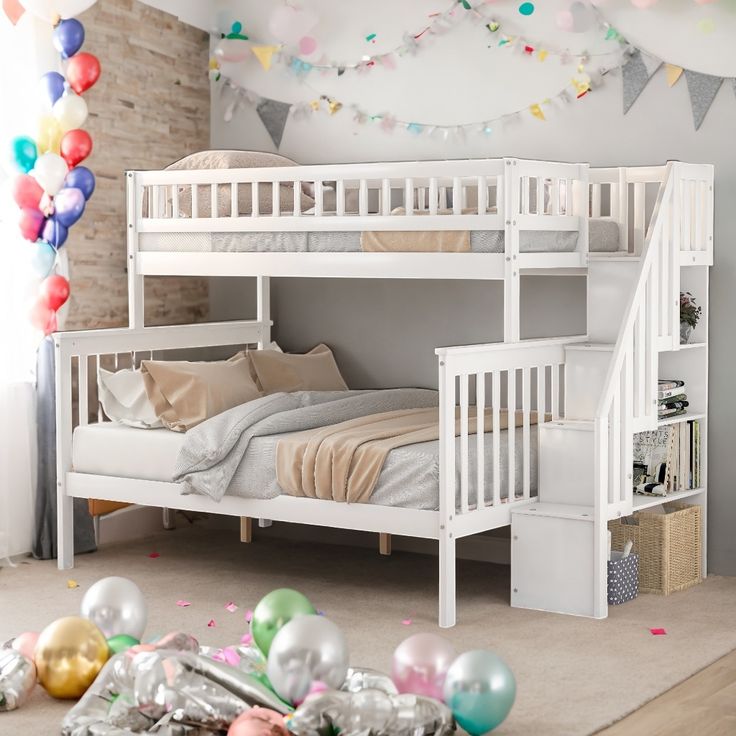 a white bunk bed sitting in a bedroom next to balloons