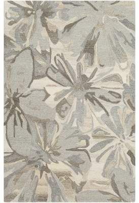 a gray and white rug with flowers on it