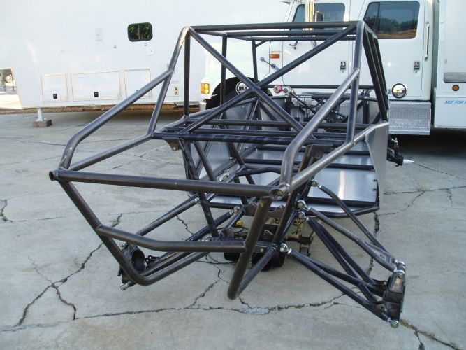 the front end of a vehicle with metal bars attached to it