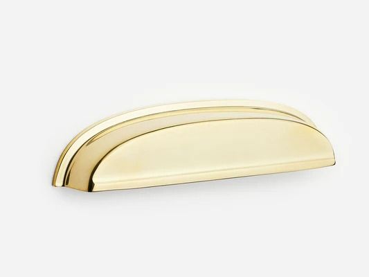 a gold door handle on a white background