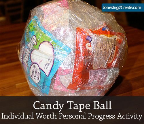 a candy tape ball sitting on top of a wooden table with the words candy tape ball individual worth personal progress activity