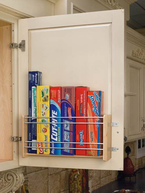 a kitchen cabinet filled with lots of different types of drinks and snacks on it's shelf