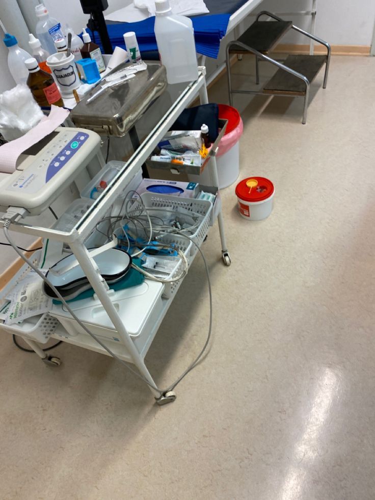 a hospital room filled with lots of medical supplies and equipment on top of each other