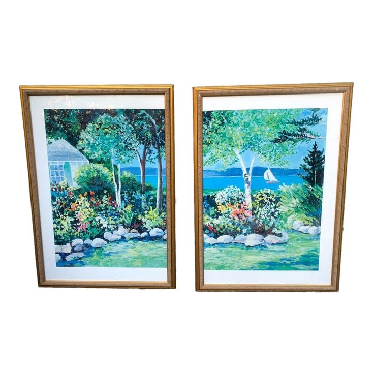 two framed paintings of trees and flowers in front of a house with the water behind them